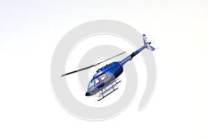 Flying helicopter isolated on white
