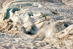 Flying in a helicopter to the glacier and then Heli hiking on the glacier floor high up in the Southern Alps mountain peaks on Fox