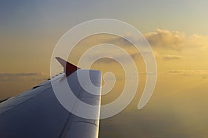 Flying High: A View from the Cabin. Wing of an airplane flying above the clouds