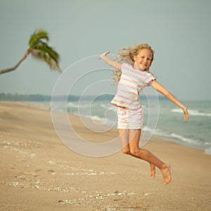 Flying jump beach girl on blue sea shore