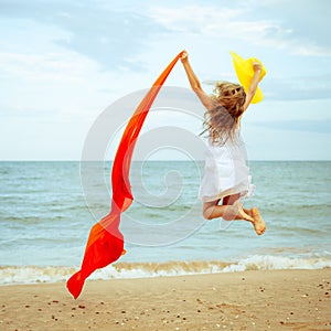 Flying jump beach girl on blue sea shore