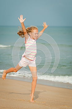 Flying jumping beach girl at blue sea shore