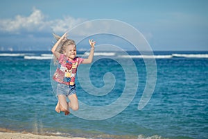 Flying jumping beach girl at blue sea shore