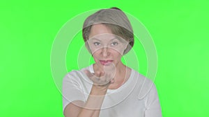 Flying Kiss by Old Woman in Love on Green Background