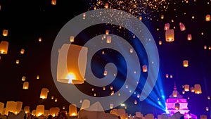 Flying lanterns in night sky in Loy Krathong festival, Chiangmai, Thailand