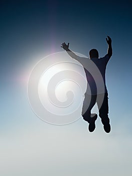 Flying man. Young man falling. Silhouette of poise man