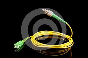 Flying optical fiber cable isolated on the black background