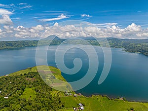 Flying over the agricultural land with Lake in Mindanao, Philippines.