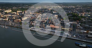 Flying over a beautiful European city at sunset. Waterford Ireland 5k