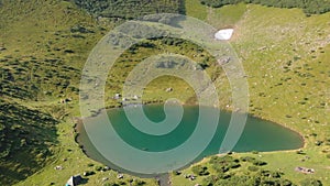 Flying over beautiful lake in Carpathians, Svydovets, Ukraine