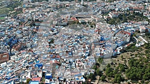 Flying over Chefchaouen and a blue city in Morocco with Drone from above (Aerial)