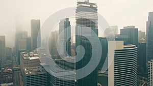 Flying over Downtown Chicago on a foggy day. Street Bridge. Traffic on Illinois Roads - Wacker Dr in Downtown Chicago