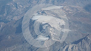 Flying over the European Alps during fall season. Landscape at the glaciers. Melting of glaciers