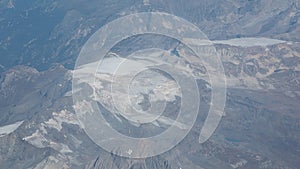 Flying over the European Alps during fall season. Landscape at the glaciers. Melting of glaciers