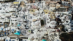 Flying Over Famous Blue Domed Church In Oia On Santorini Island In Greece