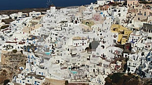 Flying Over Famous Blue Domed Church In Oia On Santorini Island In Greece