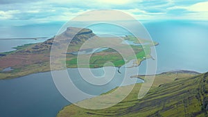 Flying over Kirkjufell mountain, one of Iceland magnificent landmarks on the Snaefellsnes peninsula