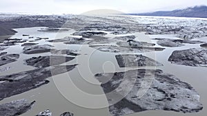 Flying over melting icebergs in Svinafellsjokull lake, Vatnajokull National Park, Iceland. Global warming envir