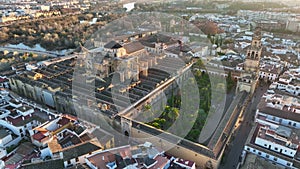 Flying over Mosque-Cathedral in Cordoba, Spain. Aerial view of Gardens of the Alcazar of Cordoba, Spain