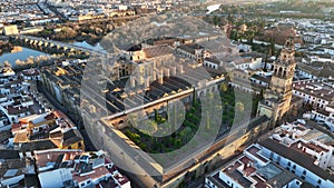 Flying over Mosque-Cathedral in Cordoba, Spain. Aerial view of Gardens of the Alcazar of Cordoba, Spain