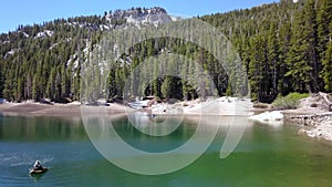 Flying over a mountain lake in California.