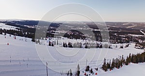 Flying over mountain, winter landscape, skiresort