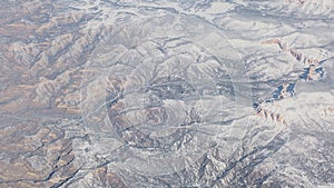 Flying over North America during winter season. Landscape from the airplane