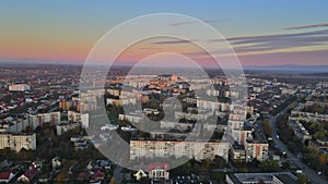 Flying over residential area in Uzhgorod city Zakarpattya of the foggy during sunrise view