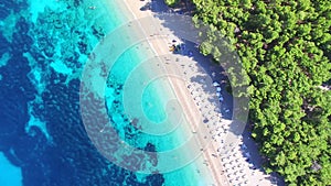 Flying over of the sandy beach Zlatni rat on the island of Brac, Croatia