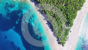 Flying over of the sandy beach Zlatni rat on the island of Brac, Croatia