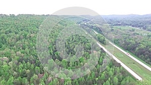 Flying over the speedway in Alabama state, USA. Forest in Background