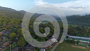 Flying Over a Village in Doi Inthanon at Sunrise