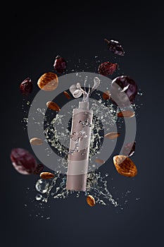 Flying packaging Cosmetic product with splashes and elements of nuts ingredients on a gray background. Poster product photography