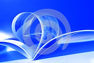 Flying pages on blue