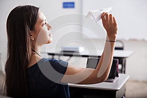 Flying paper planes in detention