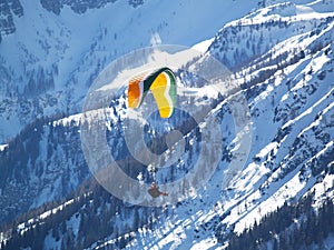 A flying paraglider.