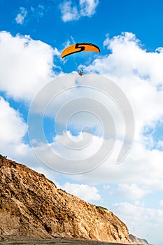 Flying paraglider