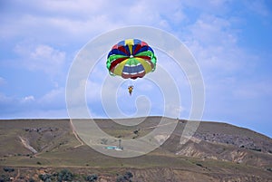 Flying paraglider in the mountain