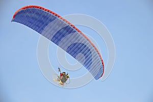 Flying paraglider in the sky - Stock image