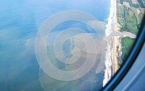 Flying in plane over coast of Oaxaca Mexico