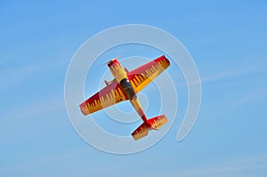 Flying the plane performs aerobatics in the sky photo