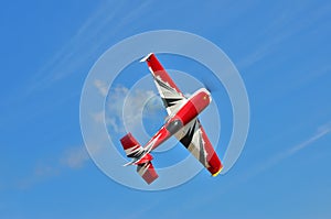 Flying the plane performs aerobatics in the sky photo