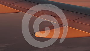 Flying on a plane, sun light flicker over wing
