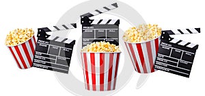 Flying popcorn and film clapper board isolated on white background