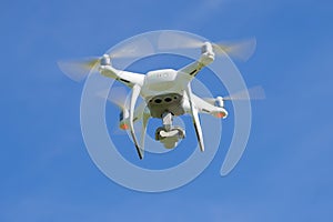 Flying quadcopter `Phantom 4 Advanced`