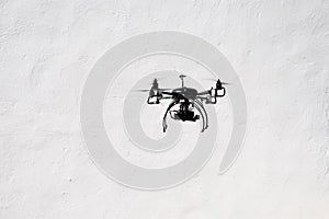 Flying quadrocopter drone with the camera