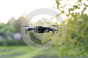 Flying quadrocopter, remote controlled drone with camera photo