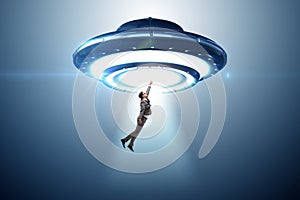 Flying saucer abducting young businessman