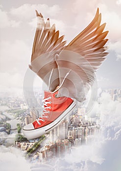 Flying shoes with wings. Red sneaker in the air