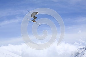 Flying skier on mountains